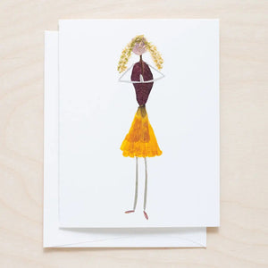 The PETAL PEOPLE PRESS - GRATITUDE CARD features a creative drawing of a girl made from dried leaves and petals on white paper, styled as botanical art, and shown on a white table with paper clips, a black tool, and green leaves.