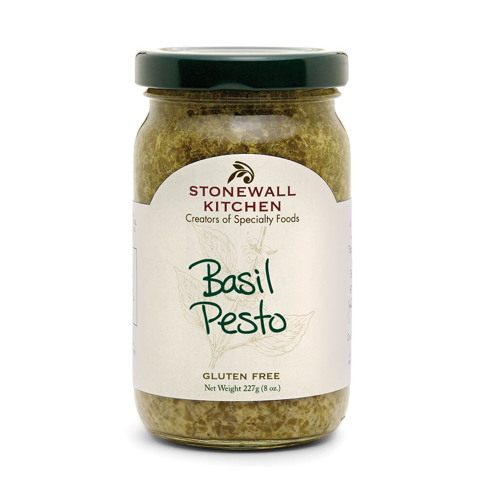 A jar of STONEWALL KITCHEN - BASIL PESTO is ideal for a quick meal. The label showcases the product name in green text with "Creators of Specialty Foods" written above it. This fresh basil pesto is gluten-free, and the net weight is 227 grams (8 oz). The jar features a green lid.