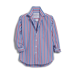 A woman smiles in sunlight while wearing the FRANK & EILEEN EILEEN Relaxed Button Up Shirt in Superluxe Cotton Stripe, accessorized with gold rings and a delicate necklace.