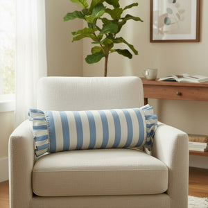 The LOOM & CLOTH Simple Stripe Ruffled Bolster Pillow in Blue showcases a 100% cotton cover with blue and white vertical stripes and elegant ruffled ends, displayed against a plain white background.