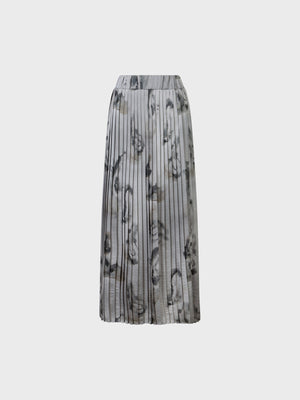 The SANDRO FERRONE Pleated Maxi Skirt in grey, by Sandro Ferrone, features a gray and black abstract pattern and is shown against a plain white background.