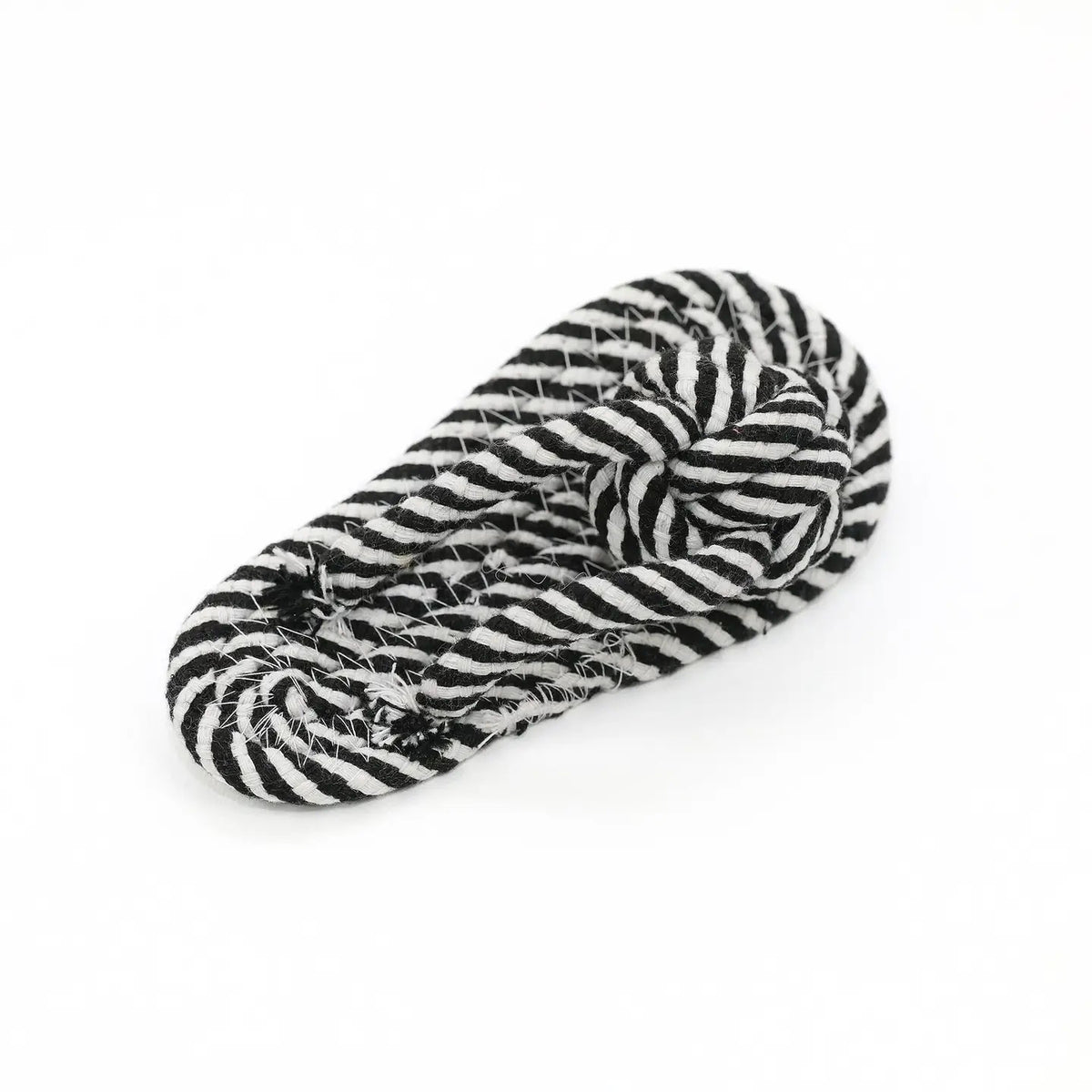 The KNOTTY PAWS - HANDMADE SLIPPER DOG TOY by KNOTTY PAWZ is a black and white striped cotton rope, coiled neatly on a white background. Its texture and pattern create an engaging design, promising fun for dogs.