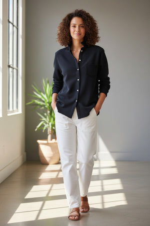 The FRANK & EILEEN Eileen Relaxed Button Up in Triple Fleece British Royal Navy showcases bust-flattering button placement, long rolled-up sleeves, and a chest pocket. Set against a light textured background, it offers classic style and ultimate comfort.