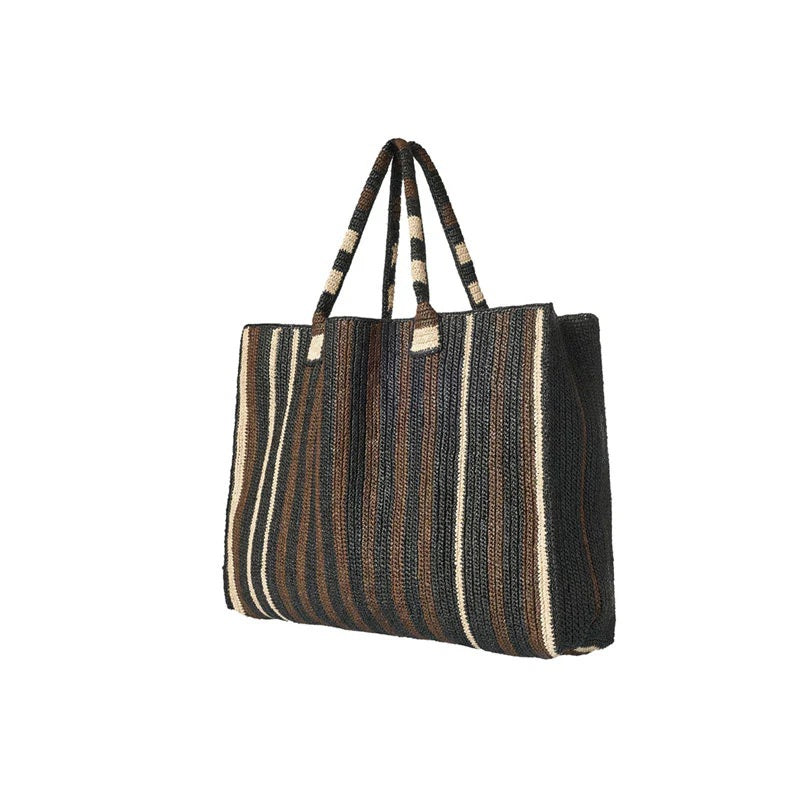 The GABRIELE FRANTZEN Little Sister Weekender Bag in Nomad features a spacious rectangular design with two handles and black, brown, and beige vertical stripes on white—ideal for stylish weekend getaways.