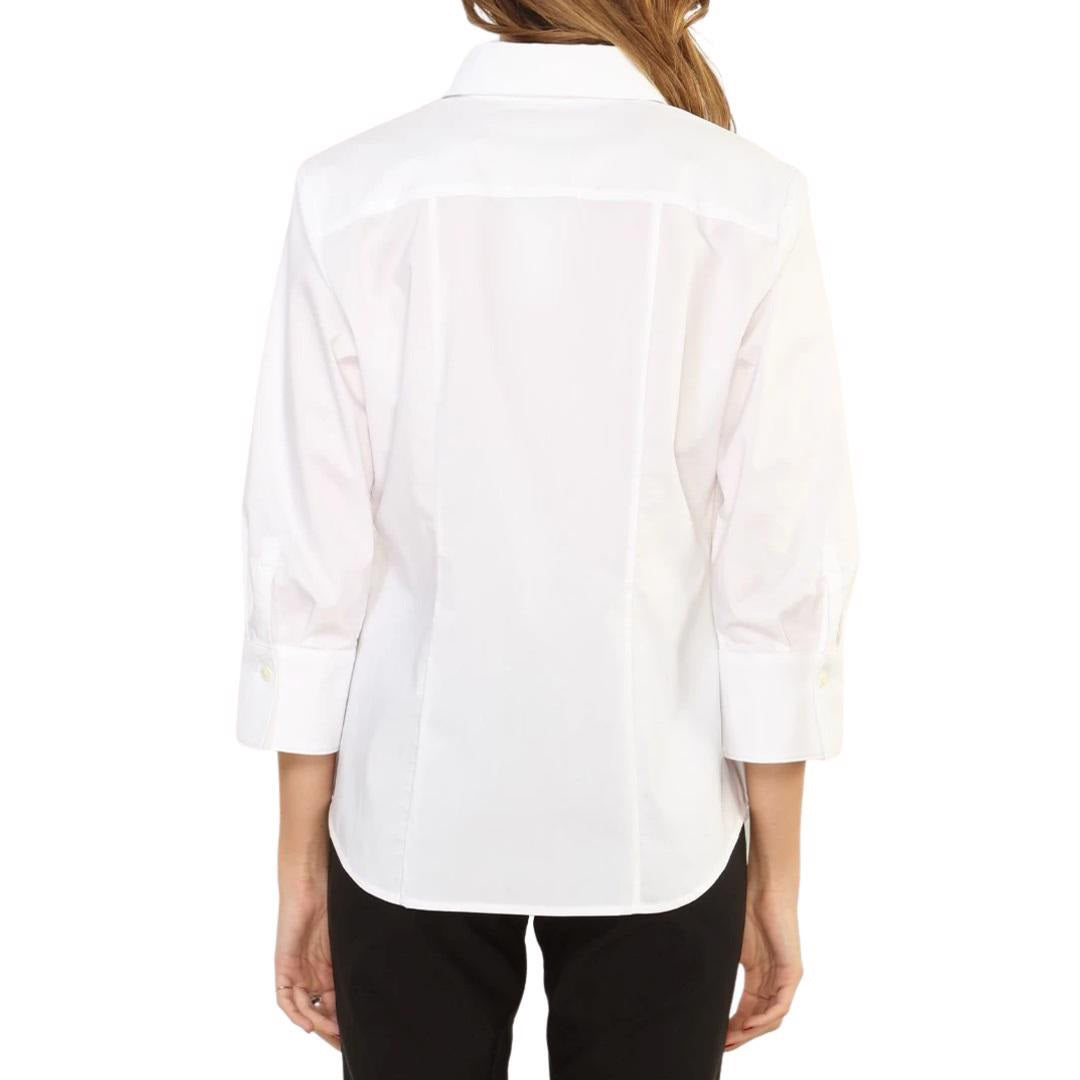 A person with long brown hair is shown from the back wearing a white HINSON WU - DIANE SHIRT with a collar and sleeves ending just below the elbows, paired with black pants.