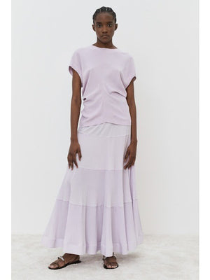 The image portrays a solid black square with a textured, slightly uneven surface. With subtle shading variations, it seems to be a photograph perfectly capturing the minimalist essence of the MEIMEIJ - CAP SLEEVE TOP from the MEIMEIJ brand.