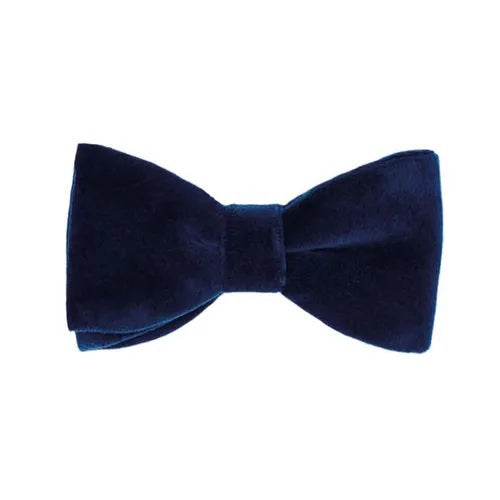 The AMANDA CHRISTENSEN - VELVET PRE-TIED BOW TIE IN NAVY is expertly crafted from cotton velvet and showcased against a white background, making it a standout choice among men’s accessories.