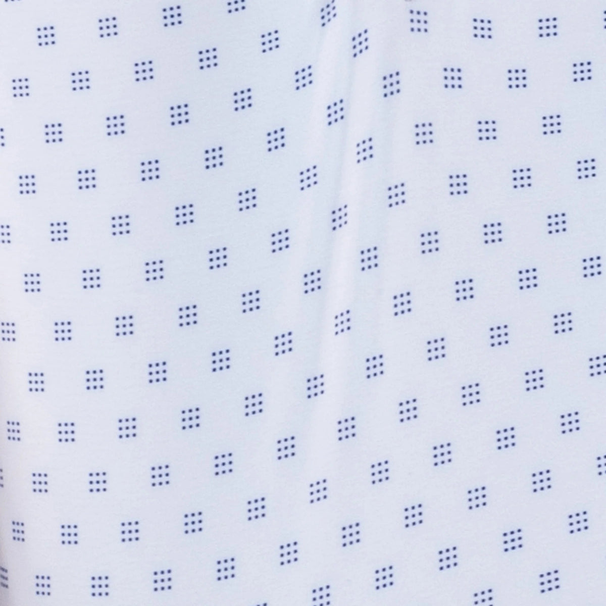 The COLLARS AND CO FEATHERWEIGHT FLEX POLO IN ORACLE WHITE features white fabric with a repeating pattern of small blue 3x3 dot squares. Slightly creased at the center, its 6-way stretch design ensures all-day comfort.