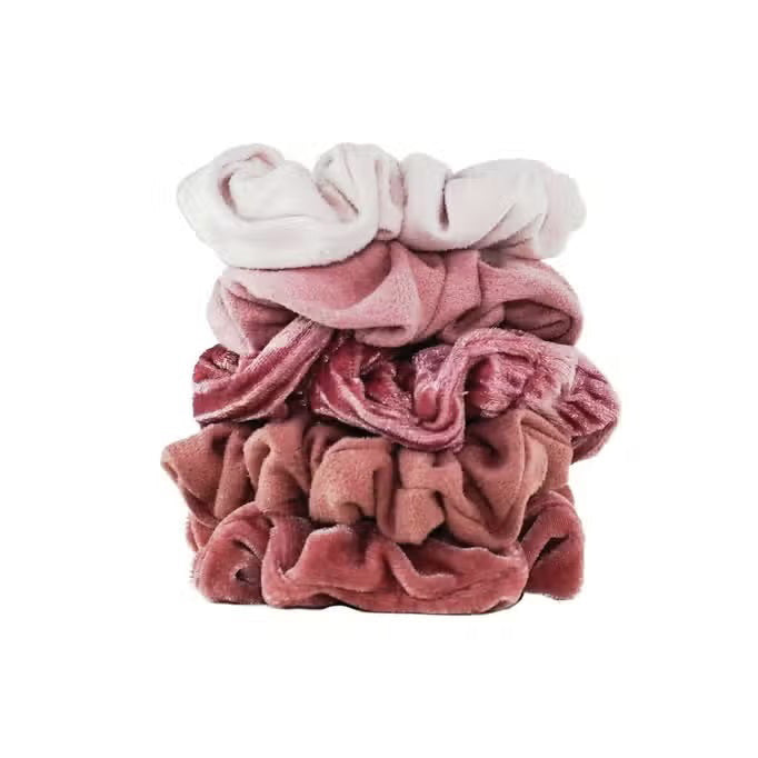 The KITSCH Velvet Scrunchies, perfect hair accessories in dusty pink and sage green, boast a soft texture. They come elegantly gathered on a white card labeled "KITSCH" with "SCRUNCHIE" below.