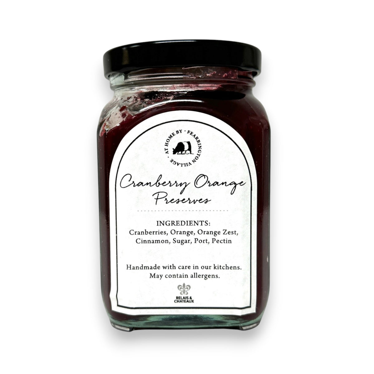 The Fearrington Housemade Cranberry Orange Preserves from the Fearrington Signature Collection, featuring a white label, are perfect breakfast jams. Made with cranberries, orange zest, cinnamon, sugar, port, and pectin by Fearrington chefs, they make an ideal handmade hostess gift. Allergen info is on the label.