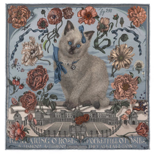 A woman holds the SABINA SAVAGE "Ring a Ring o' Roses" silk twill scarf in Glacier/Ballet, featuring a blue-eyed cat with a ribbon amidst Victorian botanicals and a historic building backdrop, with "Ring a Ring o' Roses, A Pocket Full of Posies" elegantly displayed.