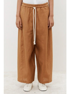 Close-up of dark fabric texture, showcasing a uniform, slightly rough surface with visible weave—ideal for crafting MEIMEIJ's Linen Drawstring Pant by MEIMEIJ, offering an adjustable fit and wide-leg silhouette.