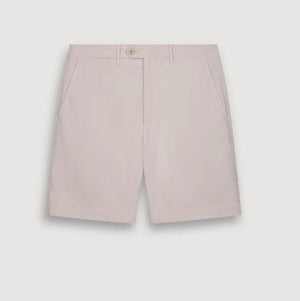 A person models the HARTFORD - TAYLOR SHORTS IN STONE by HARTFORD, shown in light beige against a plain white background. The image is cropped to display only the lower torso and legs.