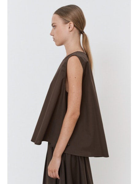 A close-up of the MEIMEIJ Sleeveless Cotton Top reveals dark cotton poplin fabric with textured, subtle horizontal lines and a slightly uneven surface in a deep, muted purple shade.