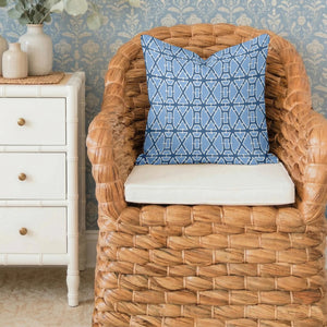 The LOOM & CLOTH Lattice Tailored Pillow in Blue features a striking blue and white geometric pattern with intersecting lines and shapes on a crisp white background. Made from soft cotton with tailored edges, this decorative square pillow brings a modern flair to any room.