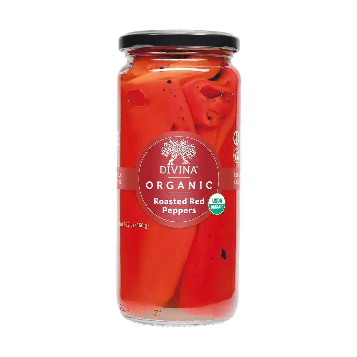 A clear glass jar of DIVINA Roasted Red Peppers features a black lid and a red label, displaying whole roasted peppers inside. The label highlights that these flavorful organic peppers are USDA Organic certified and shelf-stable for convenient storage.