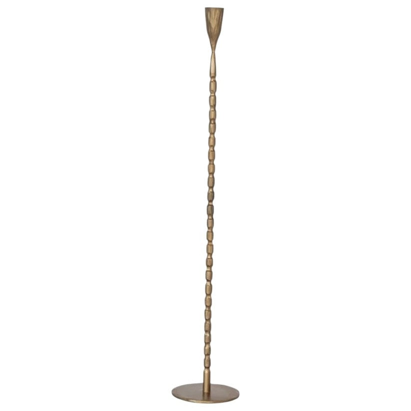 A close-up of the CREATIVE COOP CAST IRON TAPER HOLDER IN BRASS FINISH, EXTRA LARGE, featuring a textured vertical ribbed pattern and a rounded tapered cup at the top, set against a plain white background.