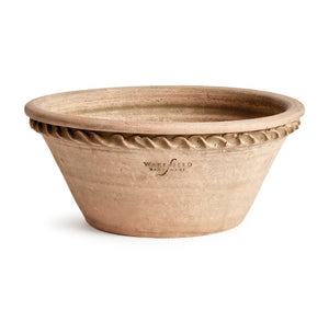 The NAPA HOME AND GARDEN - WAKEFIELD HENLEY FORCING POT is a round, shallow terracotta pot with a flared rim, rope-like edge detail, rough natural finish, and “Wakefield Handmade” stamped on the side.