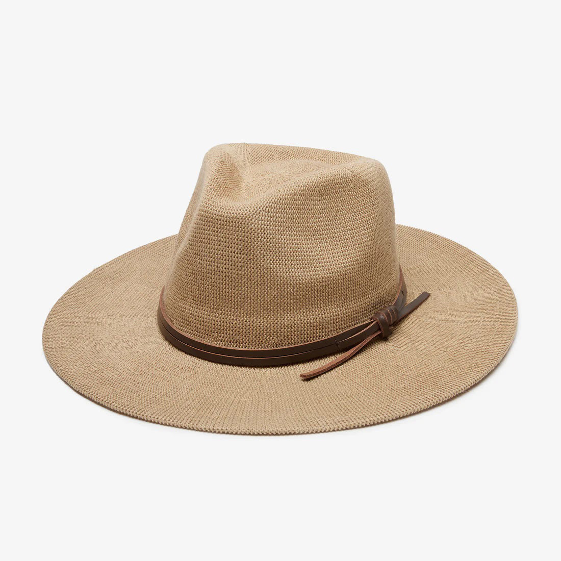 The WYETH HATS - Hudson Mesh Panama Hat in Tan by WYETH features a wide brim, woven straw design, genuine leather knotted trim around the crown, and an adjustable fit. Shown against a plain white background.