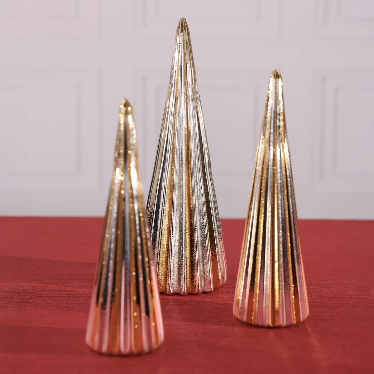 Three GOLD AND SILVER HOLIDAY TREE - LARGE glass sculptures, each 3.25 x 10 inches with a ribbed texture and alternating metallic gold and silver stripes.