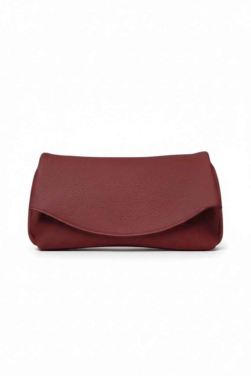 OLIVEVE Valentina Clutch in Barolo Italian buffalo cowhide, a dark red clutch featuring a curved fold-over flap.