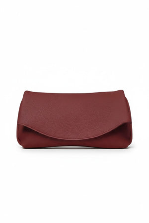 OLIVEVE Valentina Clutch in Barolo Italian buffalo cowhide, a dark red clutch featuring a curved fold-over flap.