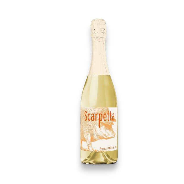 A bottle of Scarpetta Prosecco 2023, crafted from Glera grapes with a pale yellow hue. The label illustrates a pig and the brand name, WINE: FREEDOM BEVERAGE, in vibrant orange font, capped with gold foil elegantly covering the cork.