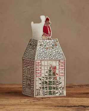 HOME FOR THE HOLIDAYS TISSUE BOX COVER shaped like a house, featuring an embroidered Christmas tree, string lights, and a teddy bear in a Santa hat for festive holiday home decor.