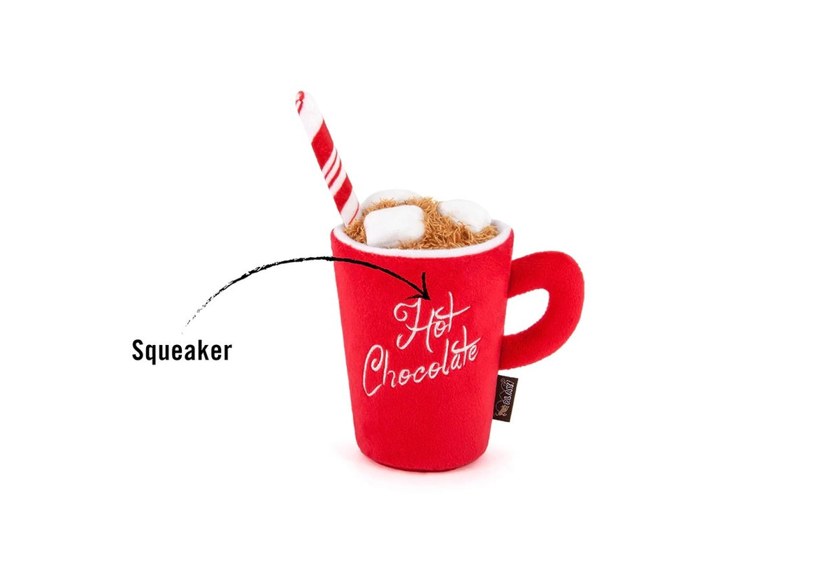 The HOLIDAY CLASSIC - HOT CHOCOLATE dog toy by PLAY PET LIFESTYLES/BRANDS features a festive red plush mug with “Hot Chocolate” embroidered on the front, topped with soft marshmallows and a striped red and white straw—making it the perfect holiday gift for playful pups.