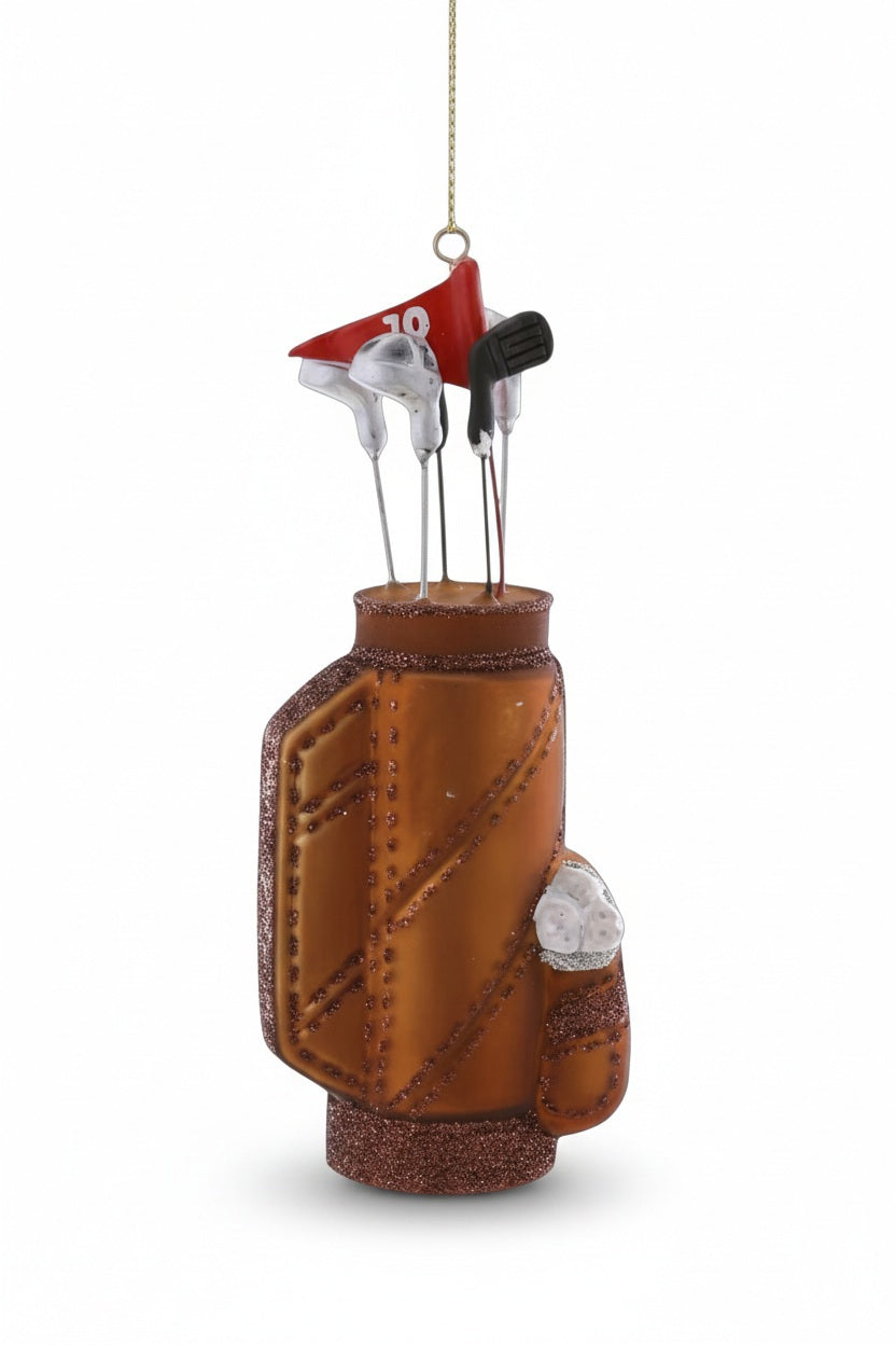 Cody Foster glass golf bag ornament, measuring 2.5 x 1.5 x 6 inches, containing several clubs and a red flag marked with the number 10.
