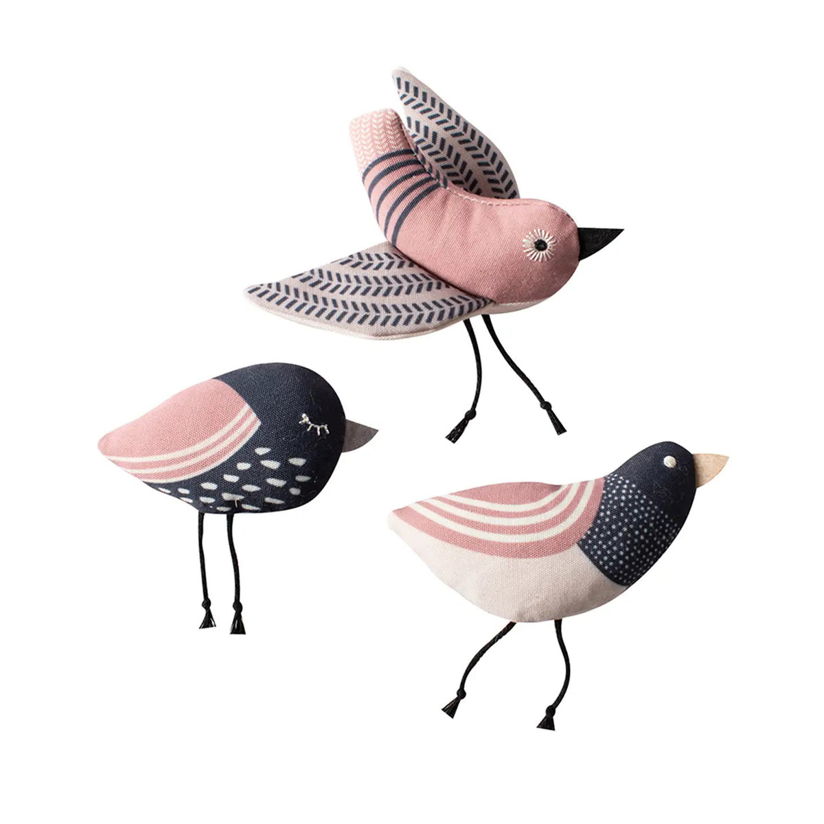 FRINGE STUDIO's "Under My Wings" cat toys by PET SHOP feature three fabric bird plushies in pink, black, and white with embroidered details, patterned wings and tails, and string legs. Made with non-toxic inks on a plain white background.