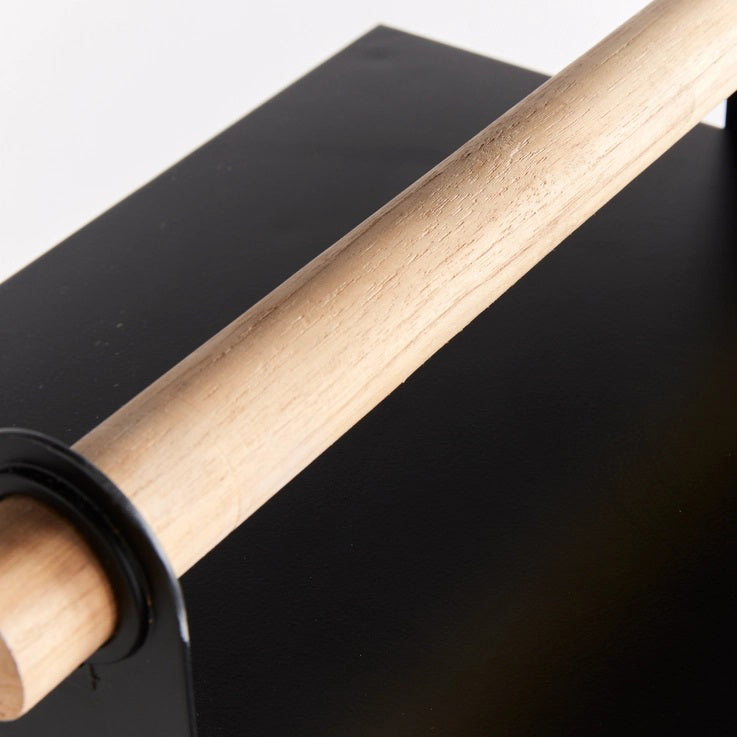 The NAPA HOME AND GARDEN ADWIN OUTDOOR LANTERN features a unique black metal and glass design with a teak handle. Inside, an unlit large white candle enhances its simple and modern appeal.