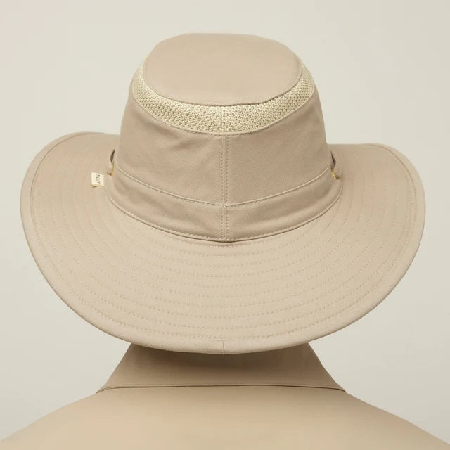 A man with a gray beard wears the TILLEY - AIRFLO HIKERS HAT T4MO-1 IN KHAKI OLIVE, featuring UPF 50+ sun protection, and a matching collared shirt, shown in profile against a plain light background.
