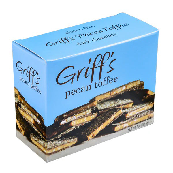 A blue box of GRIFF&#39;S TOFFEE - PECAN TOFFEE 7OZ, proudly labeled &quot;Gluten Free,&quot; features an image of dark chocolate pecan toffee pieces. With a net weight of 7 ounces (198.5 grams), this delicious treat from GRIFFS TOFFEE combines the richness of dark chocolate with the crunch of pecans for a delightful snack.