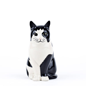 The QUAIL DESIGNS QUAIL CERAMICS - BARNEY CAT FLOWER VASE SMALL is a glossy black and white hand-painted stoneware vase, shaped like a cat sitting upright and facing left, shown against a plain white background.