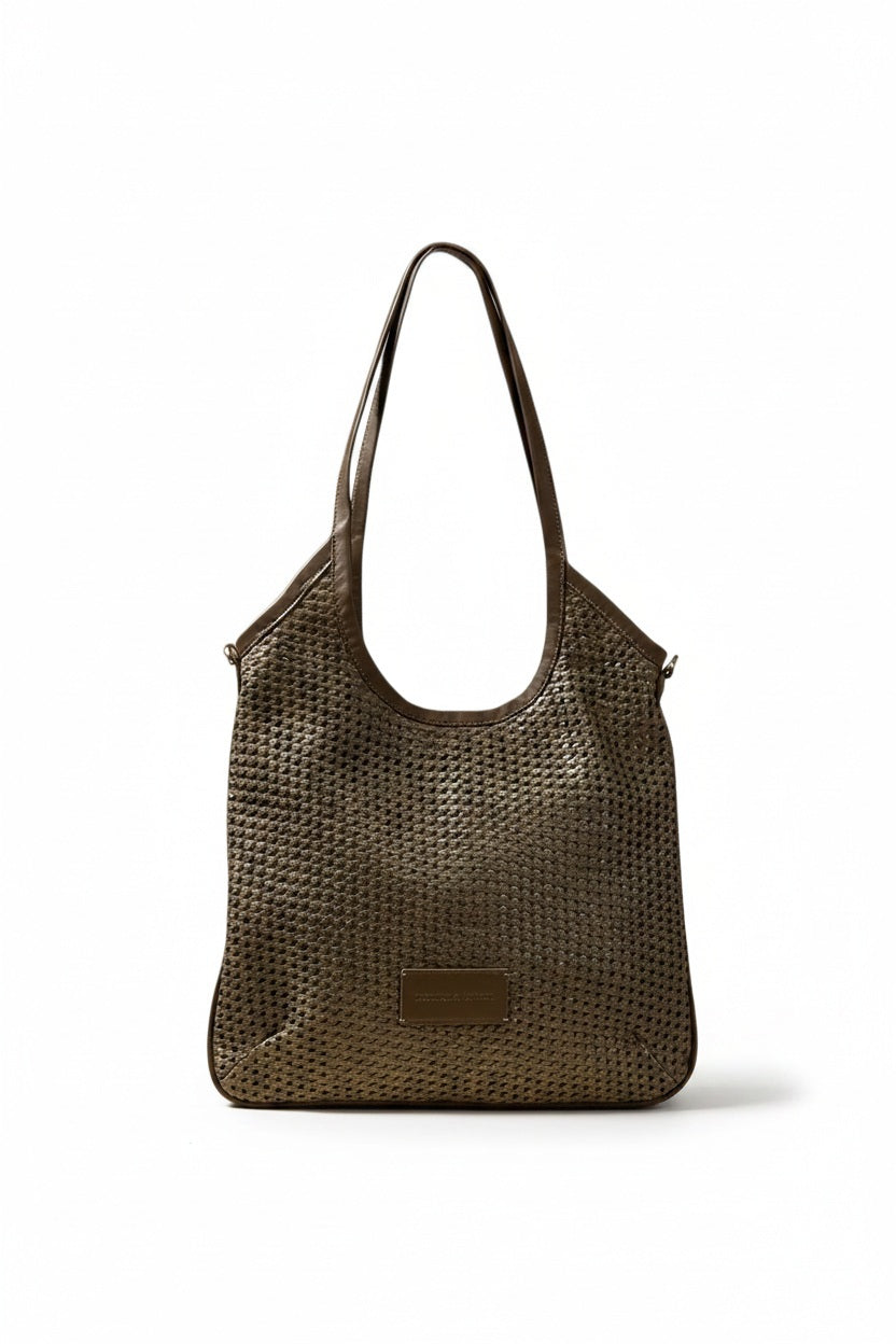 The DANIELA LEHAVI - ALBA HOBA SAC, a tan woven handbag with a single leather crossbody strap from DANIELLA LEHAVI, is displayed on a light pedestal against a beige background.