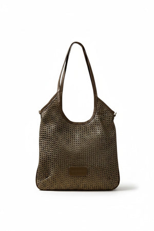 The DANIELA LEHAVI - ALBA HOBA SAC, a tan woven handbag with a single leather crossbody strap from DANIELLA LEHAVI, is displayed on a light pedestal against a beige background.