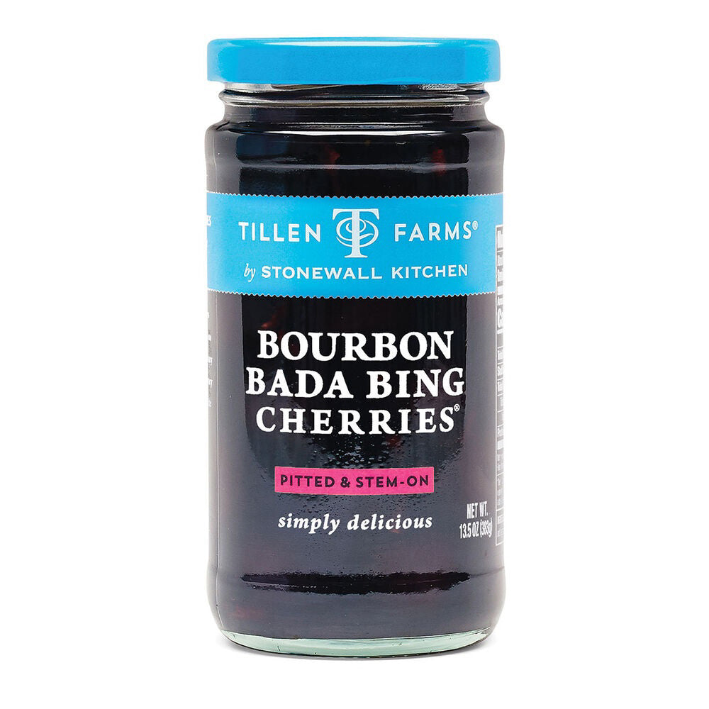 A jar of Stonewall Kitchen Bourbon Bada Bing Cherries. The label highlights these bourbon cocktail cherries are pitted and stem-on, and notes they are &quot;simply delicious.&quot; The jar contains a net weight of 13.5 oz (383g).