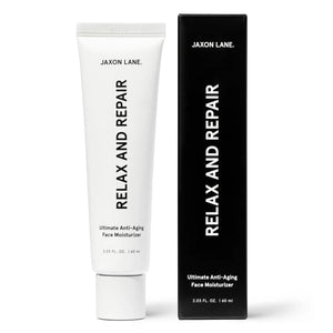 A white tube labeled "JAXON LANE - RELAX AND REPAIR ANTI AGING FACE MOISTURIZER" stands beside a matching black box. This fragrance-free men's moisturizer from JAXON LANE contains 2.03 fl. oz. (60 ml) of product.