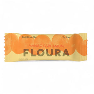 A yellow FLOURA & CO wrapper labeled "MANGO CARDAMOM FLOURA FIBER CRUSH BAR" shows orange mango slices, with text highlighting "Fruit Crush Bar," "13g prebiotic fiber," and "dairy and gluten free.
