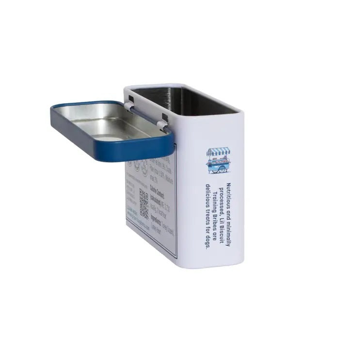 A rectangular tin with a blue lid labeled “PIPER LOOP PETS - LIL BISCUIT TRAINING BRIBES, FREEZE-DRIED TURKEY” features a puppy photo and contains 100% turkey, protein-rich treats for training and emergency recall.
