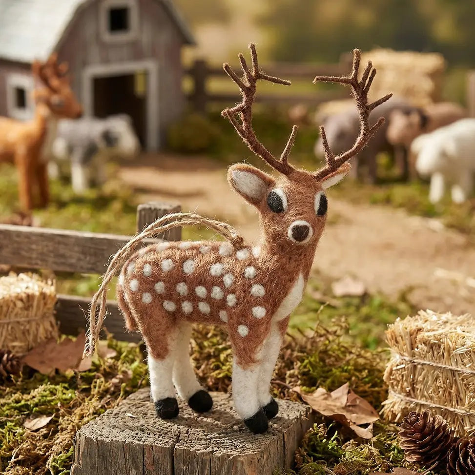 Handmade STAG ORNAMENT by FELT SO GOOD, a needle felted spotted deer with brown antlers.