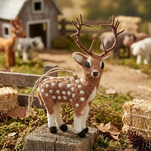 Handmade STAG ORNAMENT by FELT SO GOOD, a needle felted spotted deer with brown antlers.