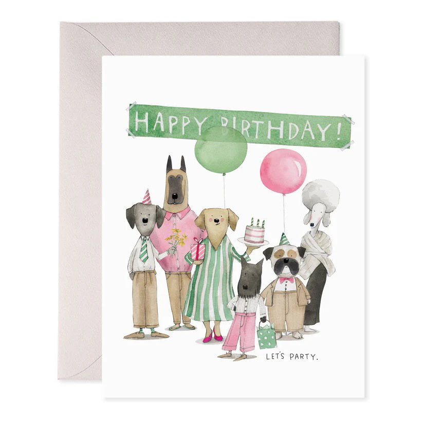 The E. FRANCES PAPER Dog Party Birthday Card is handcrafted with anthropomorphic dogs in party hats, featuring one with a cake and another with a gift. "Happy Birthday!" is highlighted in foil accents above them, while "Let's Party" appears below amidst balloons.