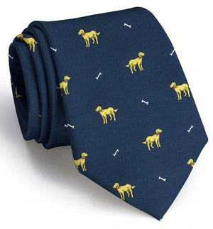 The BIRD DOG BAY - DOGGONE SILK TIE IN NAVY features a charming repeating pattern of embroidered yellow dogs and white bones, making it an ideal gift for any dog lover.