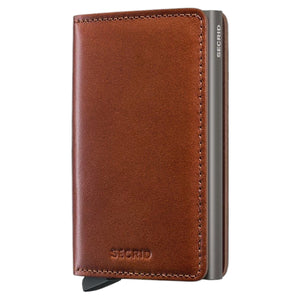 A slim, rectangular SECRID Slimwallet Texano in Saddle stands vertically, featuring a metallic finish with wooden sides. The brand name “SECRID” is printed in white near the top, exemplifying a blend of style and RFID protection for your essentials.