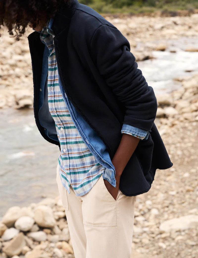 The FRANK AND EILEEN - DUBLIN KNIT BLAZER from FRANK &amp; EILEEN is showcased against a plain white background, featuring notched lapels and two front pockets. The sleeves are slightly rolled, and the fabric reveals a soft, textured appearance with a tailored fit.