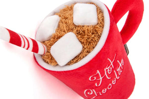 The HOLIDAY CLASSIC - HOT CHOCOLATE dog toy by PLAY PET LIFESTYLES/BRANDS features a festive red plush mug with “Hot Chocolate” embroidered on the front, topped with soft marshmallows and a striped red and white straw—making it the perfect holiday gift for playful pups.