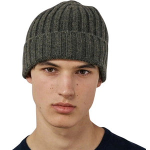 A young person wearing the HARTFORD Cashmere and Wool Beanie in Army looks directly at the camera with a neutral expression, set against a plain white background.