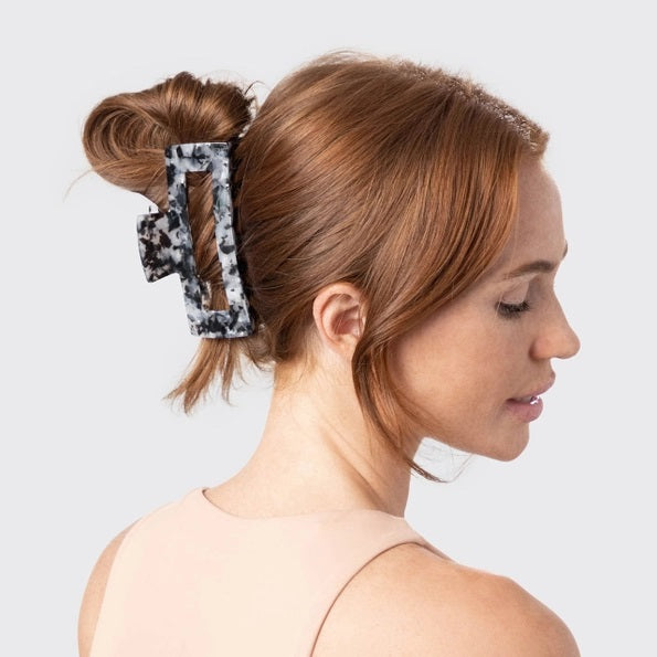 A rectangular, black marble-patterned KITSCH Eco Friendly Jumbo Open Shape Claw Clip, made from recycled materials, is displayed against a pale background with its “kitsch” branded packaging.